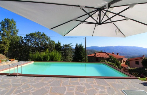 Castel Focognano Villa | Small stone house with panoramic terrace and splendid view over the green woods of the Casentino val