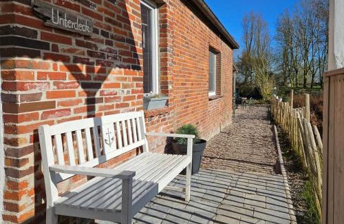 Altfunnixsiel House | Smittshörn 3 - Nordsee Ferienhaus für Gruppen und Familien mit eingezäunten Garten