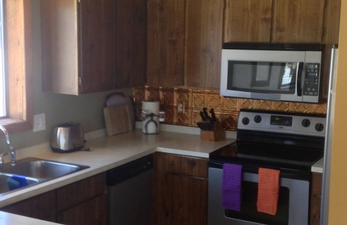 West Yellowstone Condo | Snowmobile trailer parking. Quiet, secure, in town