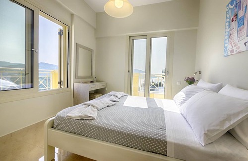 Termenades Apartment | Sofia Apartment 1 - Panoramic sea view over the entire bay of Agios Georgios Pagi