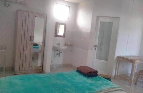 Batubulan Apartment | Soothing apartment with AC in charming Darmasaba