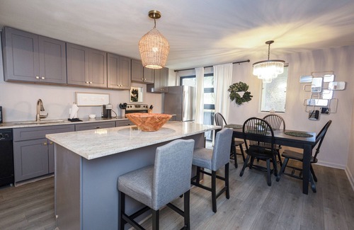Old East Dallas Condo | Sophisticated 2-Bed, 1.5-Bath furnished condo in central Dallas with a private patio, serene garden views, and exclusive access to an award-winning courtyard equipped with premium wellness products and relaxing lounge areas.