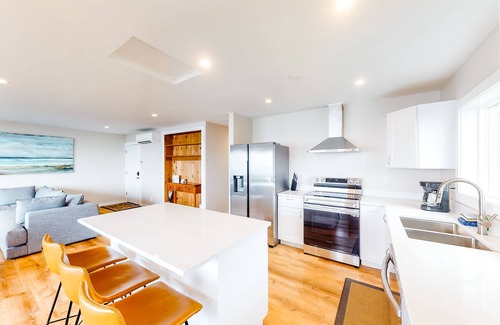 Edgewater Shores Cottage | Sophisticated oceanfront home with beach views & private hot hub - dog-friendly