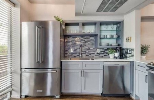 Old East Dallas Condo | Sophisticated urban loft with king suite, resort pool, and secured parking.