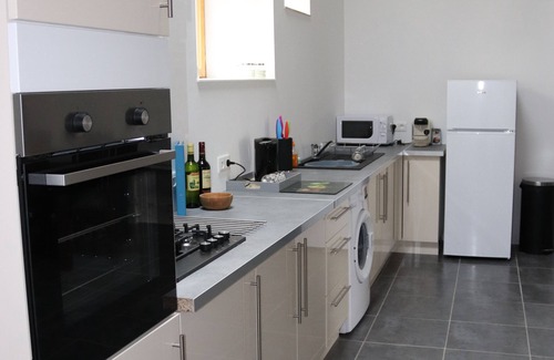 Soumeras House | Spacious, double height, beamed main space. This gite is in a rural setting.
