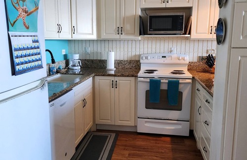Punaluu Condo | Spacious one bedroom condo on a white sandy beach!