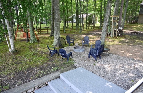Hubbard Lake House | Spacious vacation home on large private wooded lot on crystal clear Hubbard Lake