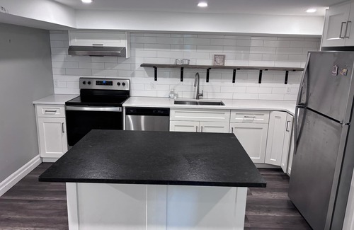 Kitchener Apartment | Specious 3 bedroom house near all amenities + WiFi, modern kitchen, and clean