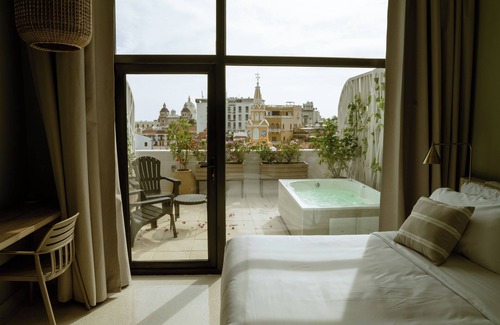 Cartagena Walled City Hotel | Spectacular views of Cartagena Clock Tower, terrace, jacuzzi, WiFi, AC