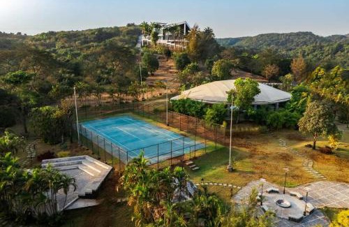 Lonavala Villa | StayVista's Emerald Acres offering a heated pool, bonfire, snooker table, scenic views, tennis court, steam room, gazebo, & gym