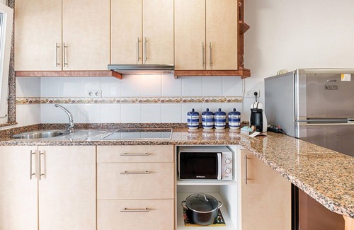 Merexo Apartment | Step into a practically equipped vacation apartment, close to picturesque stretches of coastline and