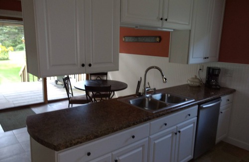 Tomahawk House | Steps from beach, snowmobile trail, boat dock. walking distance to downtown.