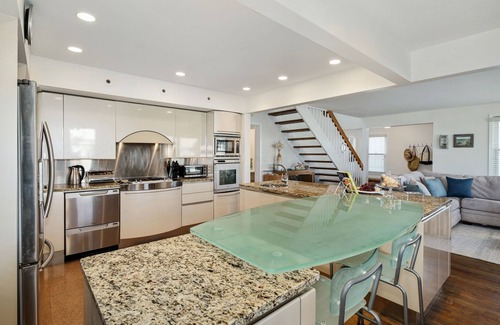 Gardens House | Steps from the pristine Gardens beach. A rare find. Welcome to The Seagate.