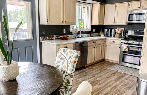 Taku - Campbell House | Striking home with fireplace, kitchen, gas grill, patio, deck, & washer/dryer