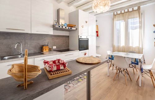 Castello di Brussa Apartment | Studio Apartment 'Appartamento Brussa Beach' with Private Terrace, Wi-Fi and Air Conditioning