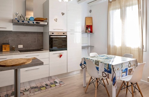 Castello di Brussa Apartment | Studio Apartment 'Appartamento Brussa Beach' with Private Terrace, Wi-Fi and Air Conditioning