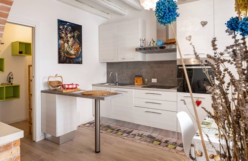 Castello di Brussa Apartment | Studio Apartment 'Appartamento Brussa Beach' with Private Terrace, Wi-Fi and Air Conditioning