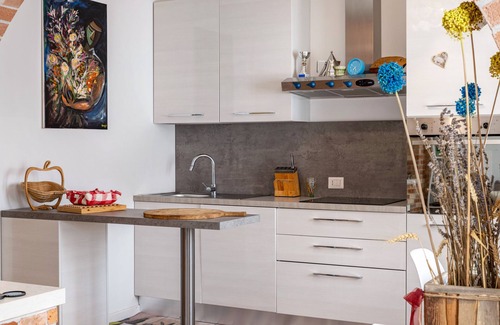 Castello di Brussa Apartment | Studio Apartment 'Appartamento Brussa Beach' with Private Terrace, Wi-Fi and Air Conditioning