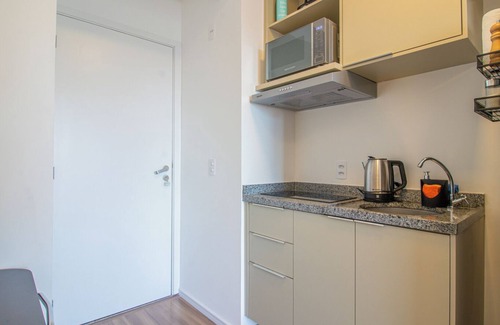 Santo Amaro Apartment | Studio elegante com varanda e ótima localização