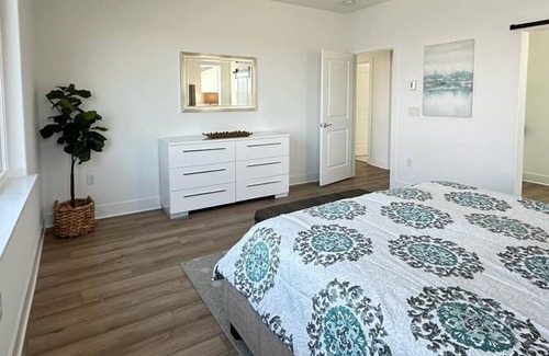 Lathrop Villa | Stunning Brand New Home on a Lake in an incredible neighborhood