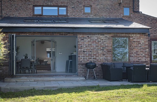 Wimbolds Trafford House | Stunning grade 2 listed barn conversion with countryside views