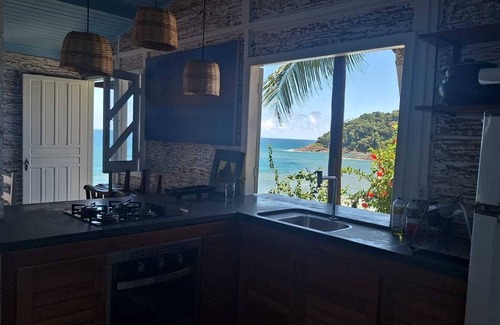 Itacare Ski Chalet | Stylish cabin with large deck overlooking Costa and Tiririca beaches.