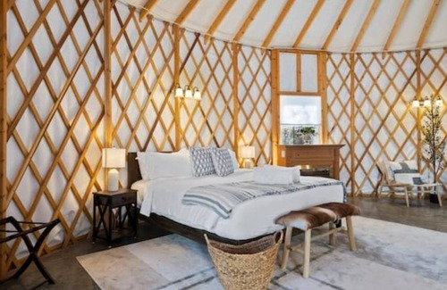 Stanley Cottage | Stylish yurt with luxurious king bed.