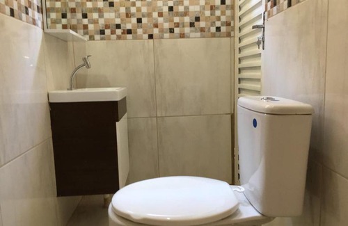 Mateiros House | SUÍTE 01 - com cozinha compartilhada