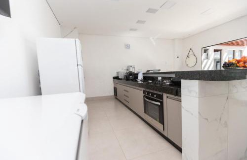 Setor Lagoa Quente House | Sua Casa Perfeita c/4 Suítes e Piscina Aquecida