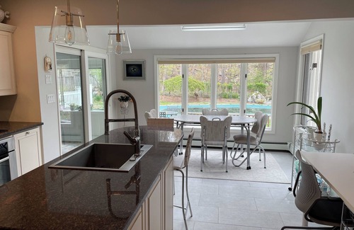 Greenwich House | Summer retreat with salt water pool on tranquil woods.
