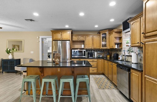 Pinellas Park House | Sun Coast Paradise: Fenced Terrace w/Pool, Spa. Gourmet Kitchen/Game Room Pets OK