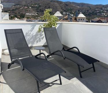 Velilla-Taramay Apartment | Sunny penthouse beach apartment with panoramic views