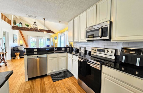 Vilano Beach House | Surfside Oasis ~Tropical Pool! Walk to the Beach! Beautiful Setting. Bikes Included!