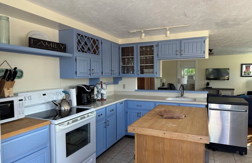 Suttons Bay Cottage | Suttons Bay, in town and steps away from beach - trail, wineries and shopping