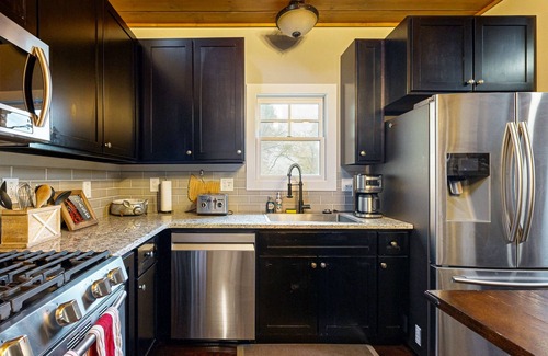 Cullowhee House | Take in the natural beauty from this elegant riverfront home