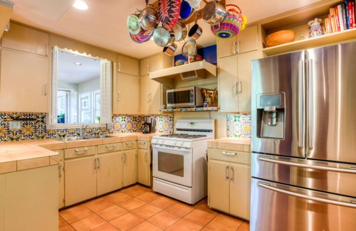 Allandale House | The CHA CHA CHA is a colorfully decorated home in a desirable neighborhood.