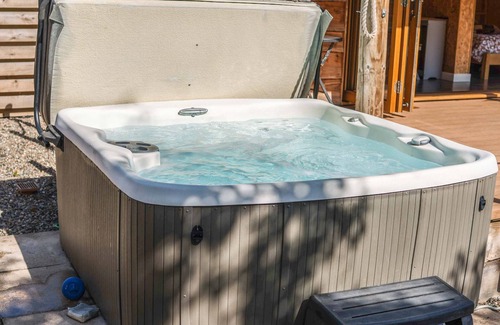 Carlisle Cabin | The Chard with hot tub overlooks a wildlife pond sleeping 2