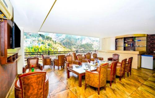 Hansot Mahal Hotel | The Divine heights Mcleodganj #centrally heated & air cooled #scenic mountain view #big parking #on mall road #top rated #most awarded #premium rooms #bar #terrace #lift #property of the year # BY VAIKUNTH#