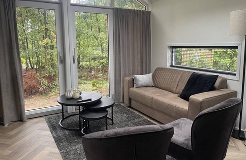 Municipality of Rhenen House | The Forest Cottage Deluxe is located right on the edge of the forest!