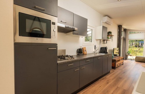 Municipality of Apeldoorn House | The Forest Lodge is a contemporary and surprisingly spacious chalet.