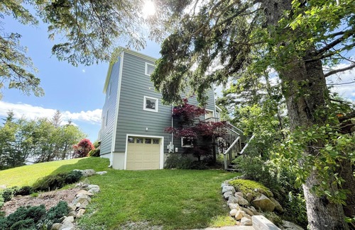 East River Point House | The oceanside Hideaway is nestled between the trees with stunning ocean views