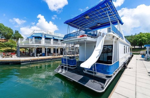 Allons Boat Rental | The Stillwater Houseboat 75' - Medium Houseboat, 6 bedrooms,waterslide, fireplace on rooftop lounge area