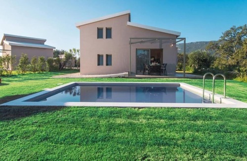 Doukades Villa | The villa's large private garden leads directly to the outdoor private pool.
