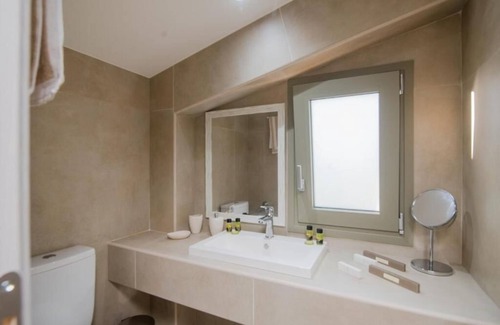 Doukades Villa | The villa's large private garden leads directly to the outdoor private pool.