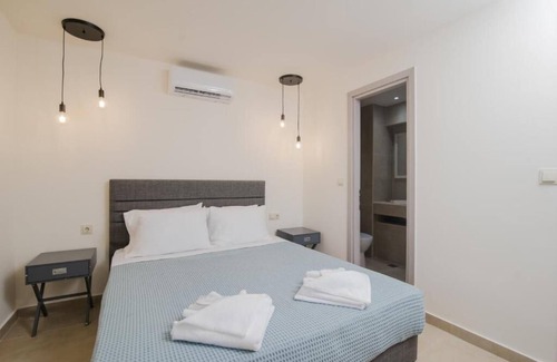 Doukades Villa | The villa's large private garden leads directly to the outdoor private pool.