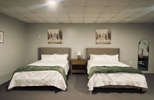 Wellston Bed & Breakfast | The Woods Suite #302 Free Arcade, Movie Theater, Patio Area, Playground and more