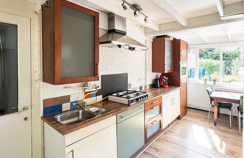 Rekem House | This beautifully situated vacation home is located in a wooded area in a welcoming vacation park nea