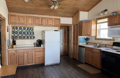 Niobe Cottage | This charming lake cottage located in a peaceful, safe community right on the lake!
