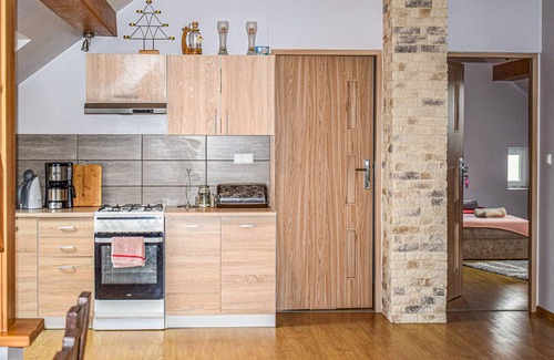 Biskupiec Apartment | This cozy vacation apartment is located in the Polish village of Najdymowo.