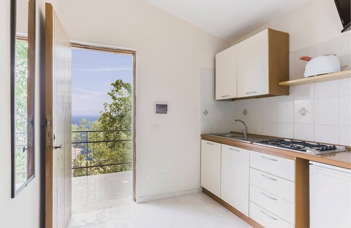 Monte Chiaro Apartment | This modern bungalow belongs to a vacation home complex directly above the sea, with a unique panora